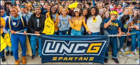 Students with UNCG banner